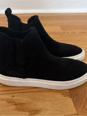 UGG women’s Black Suede Slip-On Sneaker with White Sole